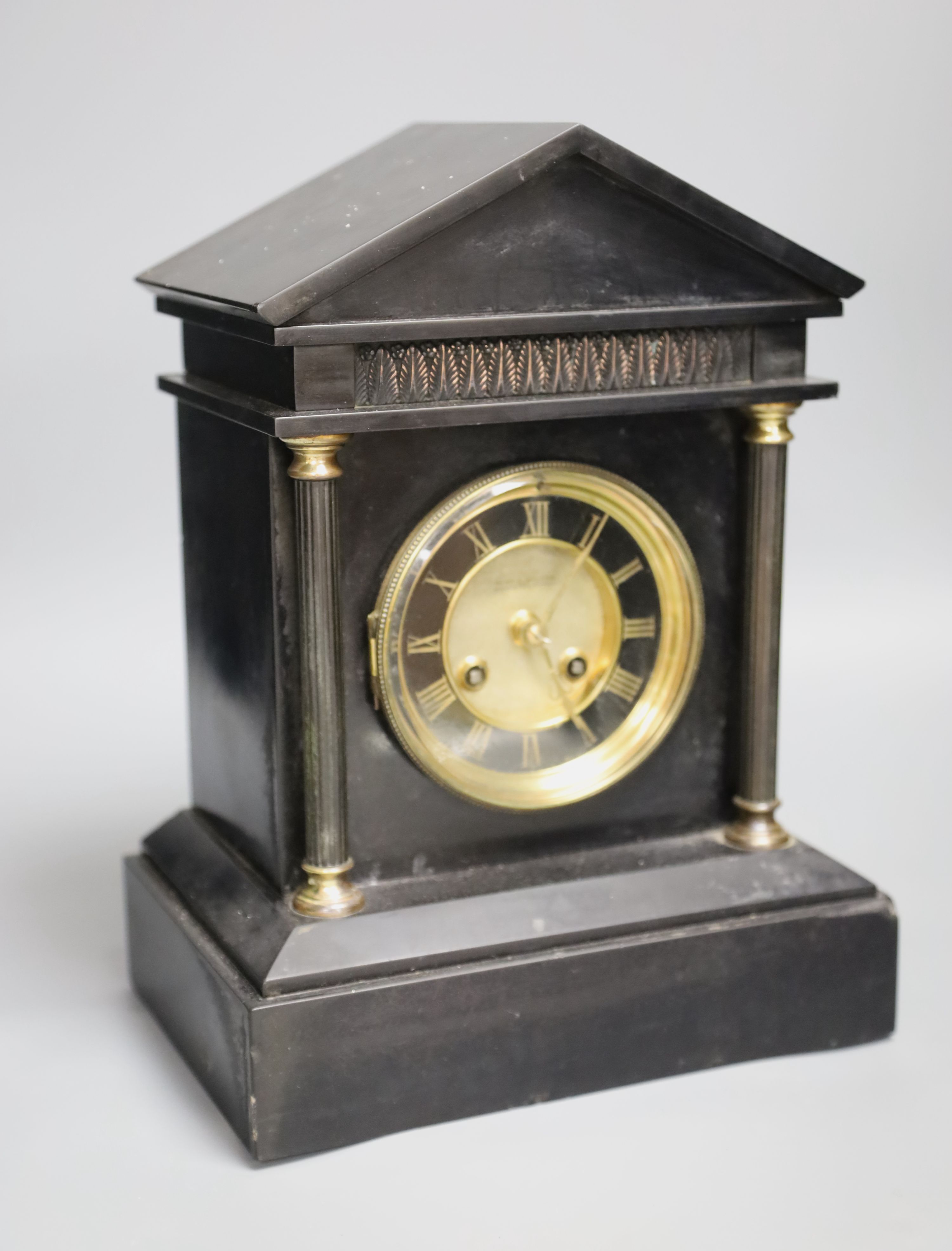 Kemp & Wilcox of Wolverhampton. A Victorian black slate mantel clock, height 31cm